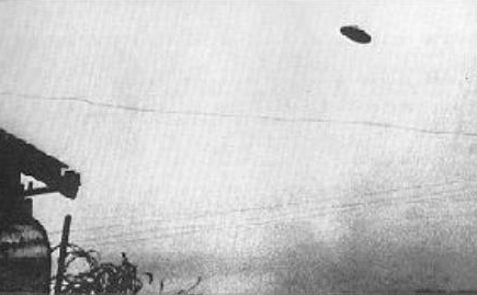 A cold war-era photograph of a flying saucer